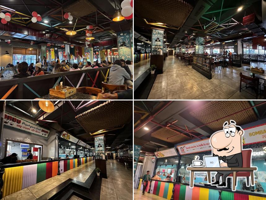 Take a seat at one of the tables at PanchGaon-Proudly Desi Restaurant