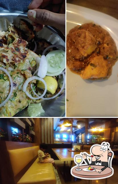 Take a look at the image displaying food and interior at Santosh Family Dhaba