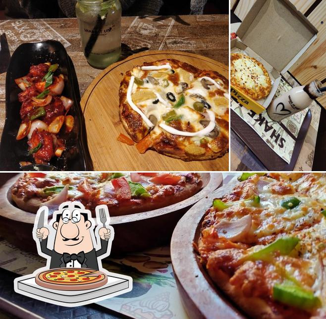 Get pizza at Brass City Cafe