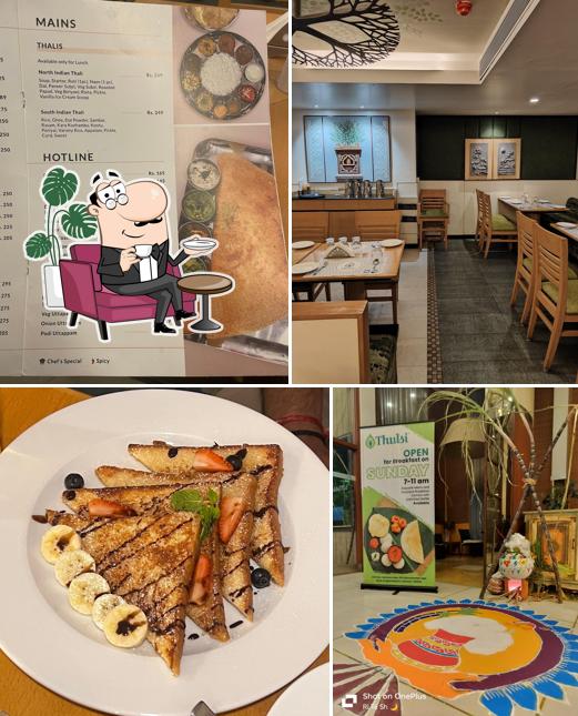 Take a seat at one of the tables at Thulsi Restaurant - Pure Vegetarian