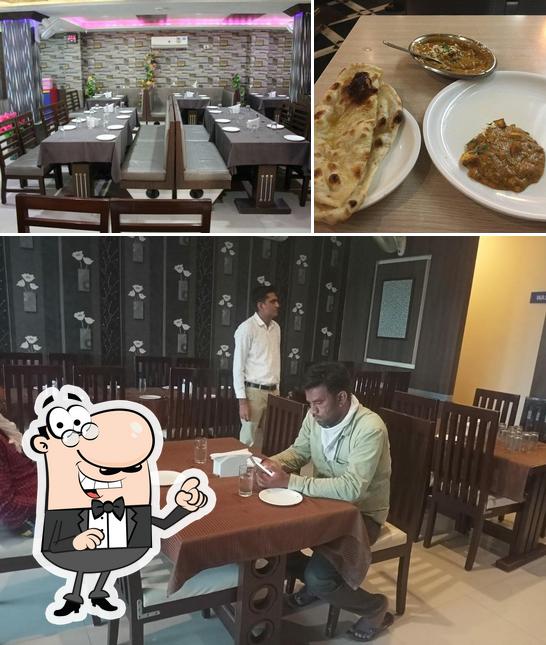 The photo of Uma Parlour and Restaurant’s interior and dining table