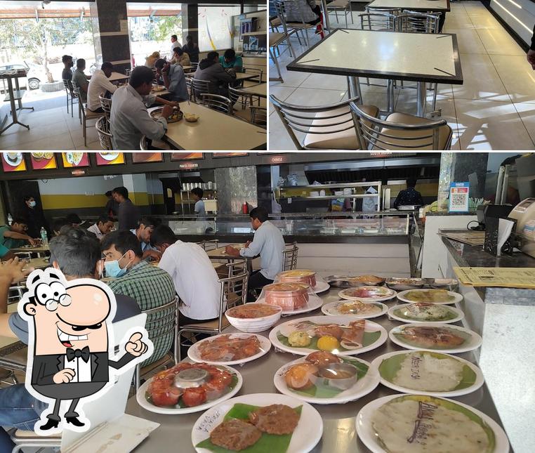 Take a seat at one of the tables at Hotel Shanthi Sagar ಹೋಟೆಲ್ ಶಾಂತಿ ಸಾಗರ್