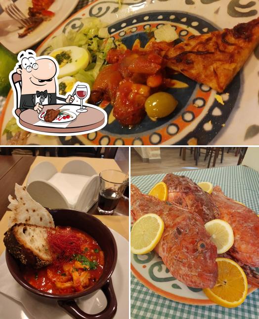 Ordina i piatti di carne a Trattoria Il Brucaliffo, Trapani