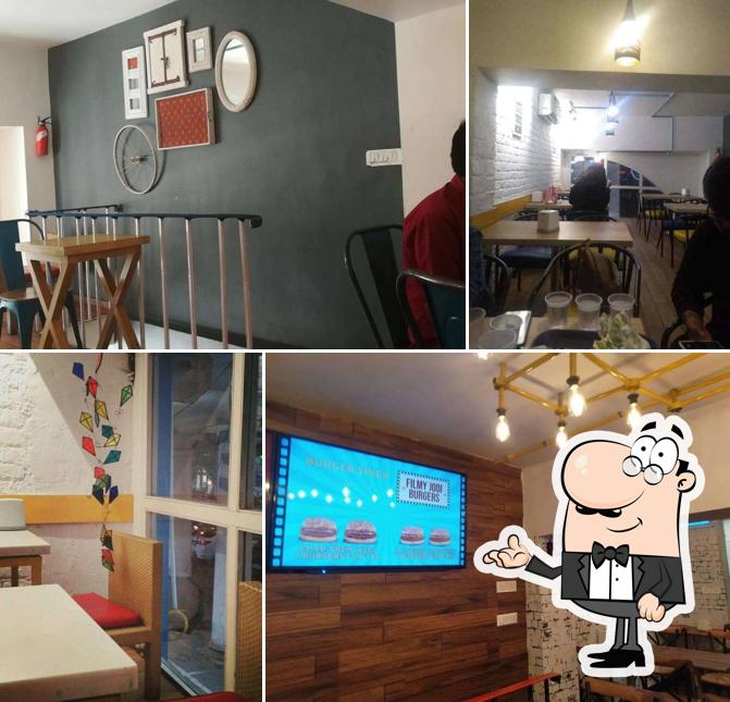 Take a seat at one of the tables at Burger Singh - Big Punjabi Burgers