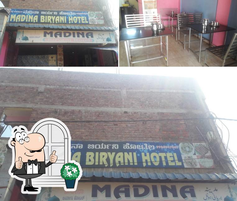Take a look at the image depicting exterior and interior at Madina Biryani Hotel