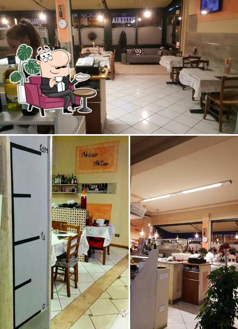 Dai un'occhiata agli interni di 1/2Metro Pizzeria & Ristorante