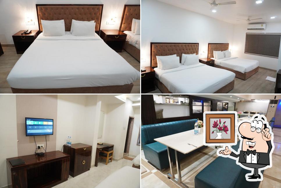 Take a seat at one of the tables at Hotel Grand Tulsi