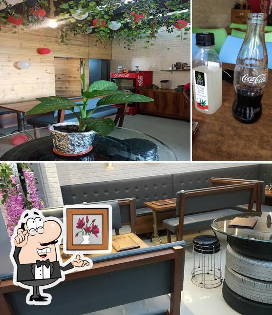 The picture of interior and beer at Sizzling Culture - Adajan