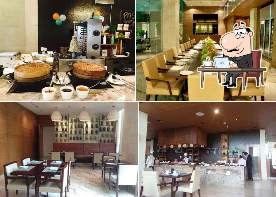 Take a seat at one of the tables at Okra - Jaipur Marriott Hotel