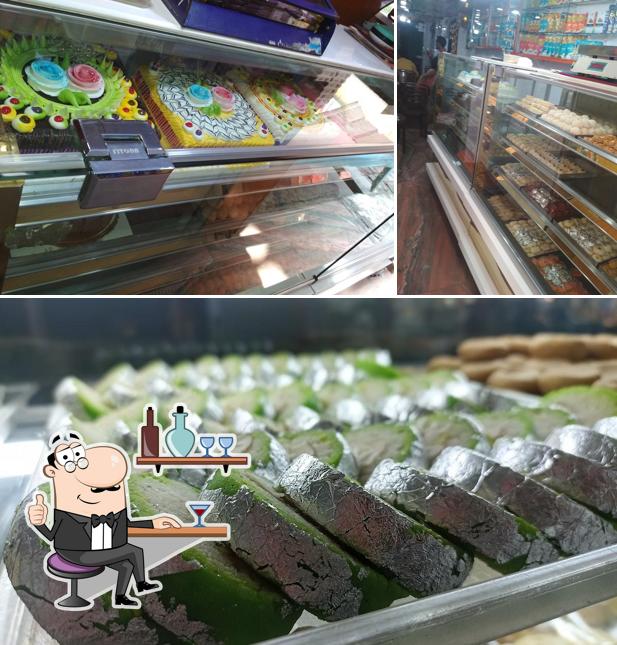 This is the photo showing interior and food at Bhushan Sweet House