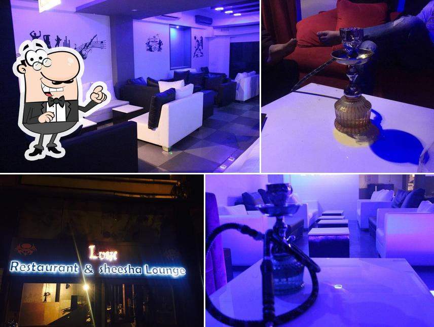 Take a seat at one of the tables at Lush Restaurant & Sheesha Lounge
