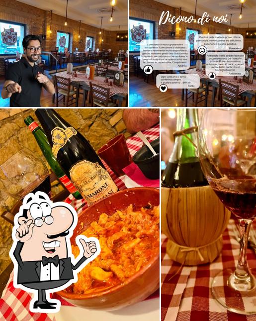 Questa è la immagine che mostra la interni e bevanda di Osteria Dalì Di Claudio Vinci