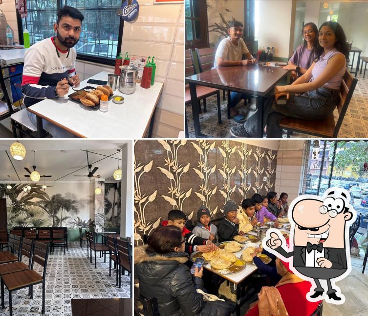 Take a seat at one of the tables at Aakash Cafe & Restaurant (Breakfast,Lunch,Dinner)