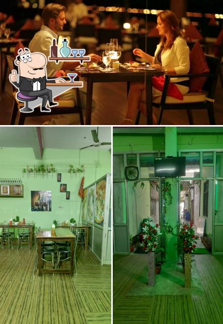 Take a seat at one of the tables at Fukrey Restaurant & Auraiya Daa Deshi Dhaba