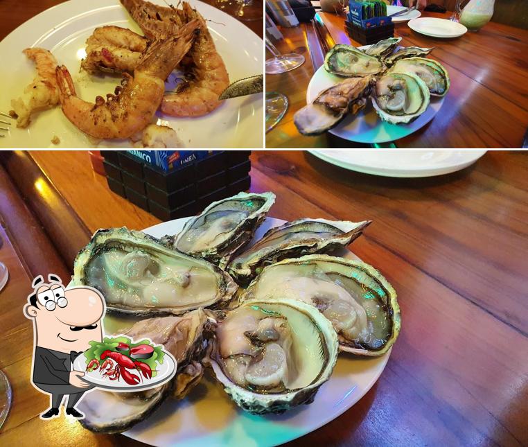 Peça diferentes refeições de frutos do mar oferecidos no Restaurante Marius Degustare