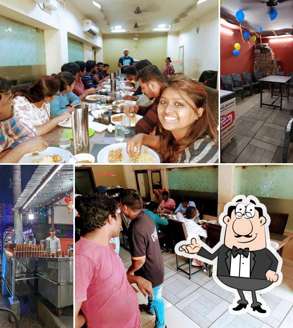 Take a seat at one of the tables at Dawat Biryani House