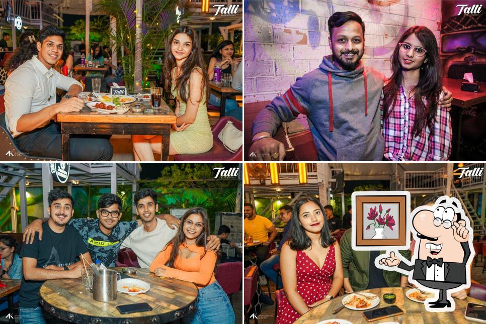 Take a seat at one of the tables at Talli Bar & Kitchen