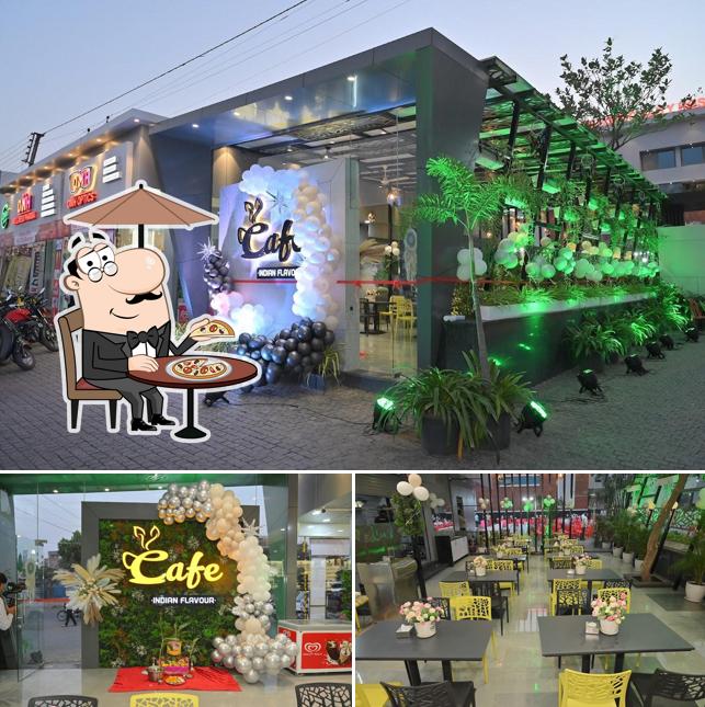 Check out the photo showing exterior and interior at Cafe Indian Flavour