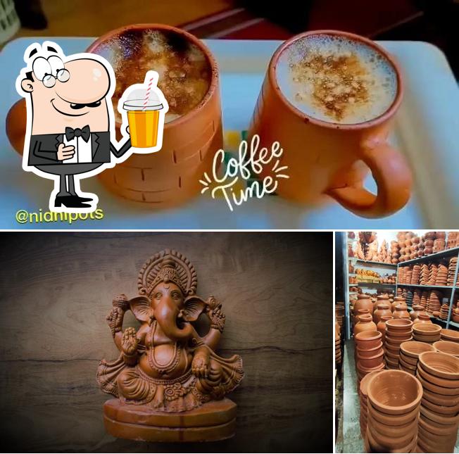 Enjoy a drink at Nidhi Clay Pottery & Home Improvement Nidhi Bakes