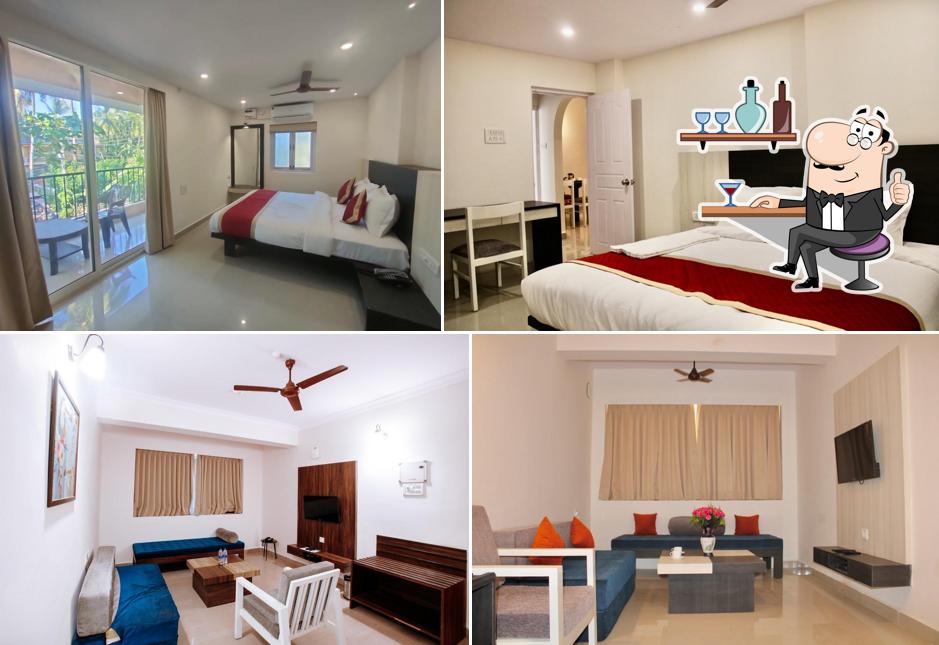 Take a seat at one of the tables at Kay's Calangute Resort Service Apartments