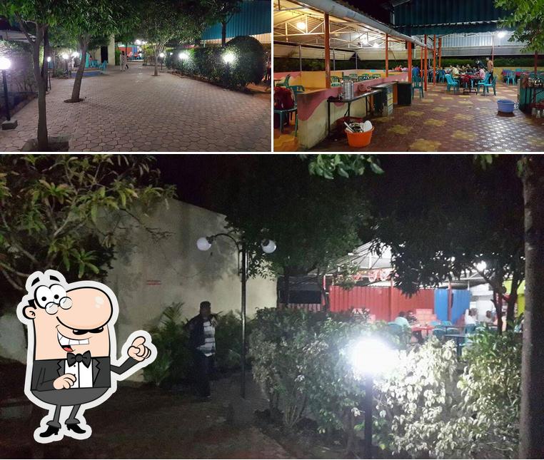 This is the image showing exterior and interior at Hotel Palvi Pure Veg Restaurants Miraj