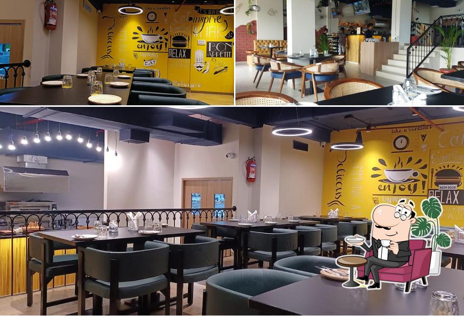 Take a seat at one of the tables at Pin & Pan Cafe