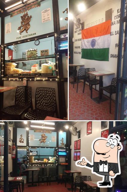 Take a seat at one of the tables at VINAYAGA