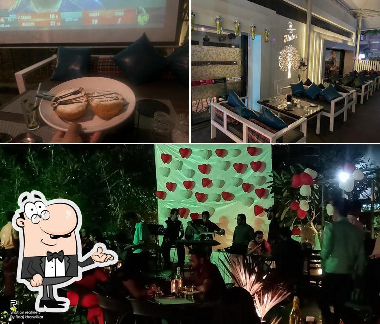 Take a seat at one of the tables at Flute Resto & Bar