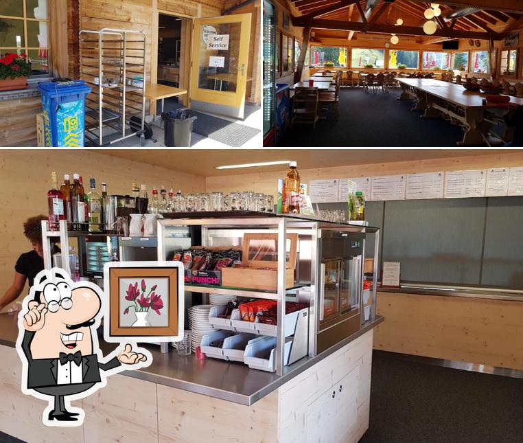 Siediti a un tavolo di Restaurant Bärghuus Riggisalp