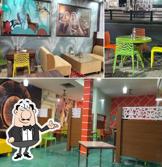 Take a seat at one of the tables at vaishno apna Dhaba