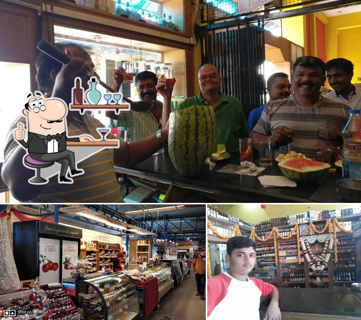 Take a seat at one of the tables at Deepa Bar & Restaurant