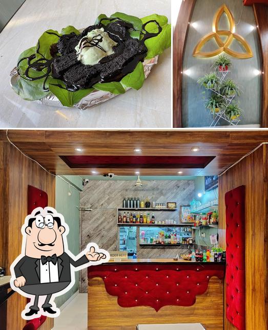 The image of interior and dessert at Herb's & Chillies (Saffron Cafe & Restro)