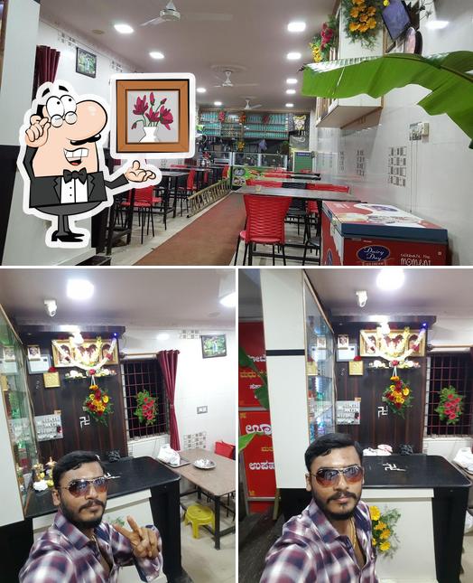 Take a seat at one of the tables at Hotel madhu darshan