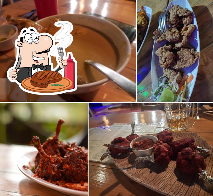 Order meat dishes at Alvares restaurant and bar
