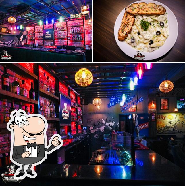 The image of The Passenger's Bar’s exterior and pizza