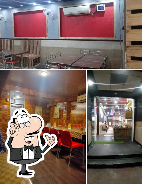 Take a seat at one of the tables at Maheshwari’s rasoi - pure veg multi cuisine food outlet