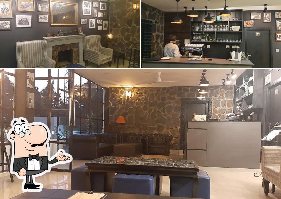Take a seat at one of the tables at The Vine - Coffee Shop