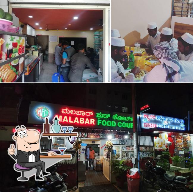 Take a seat at one of the tables at Malabar Food Court