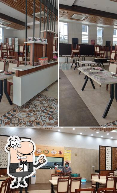 The interior of Aswins Veg Restaurant Aswins Sweets & Snacks