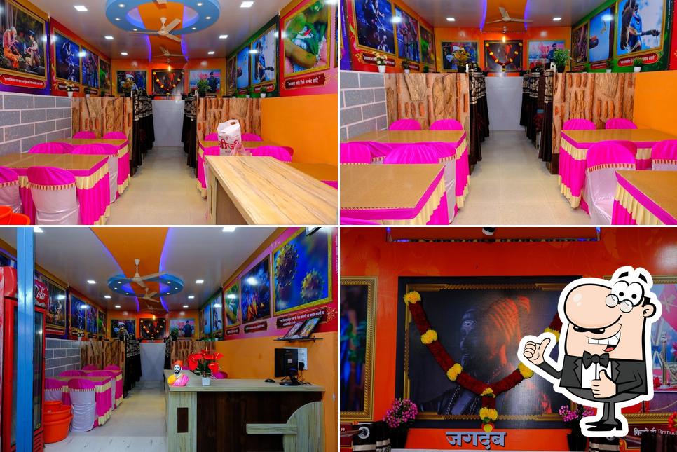 Look at the photo of Sangam chicken house