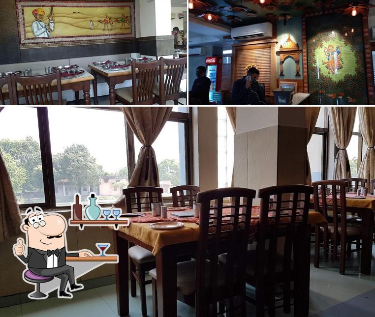 Take a seat at one of the tables at Natraj Dining Hall And Restaurant