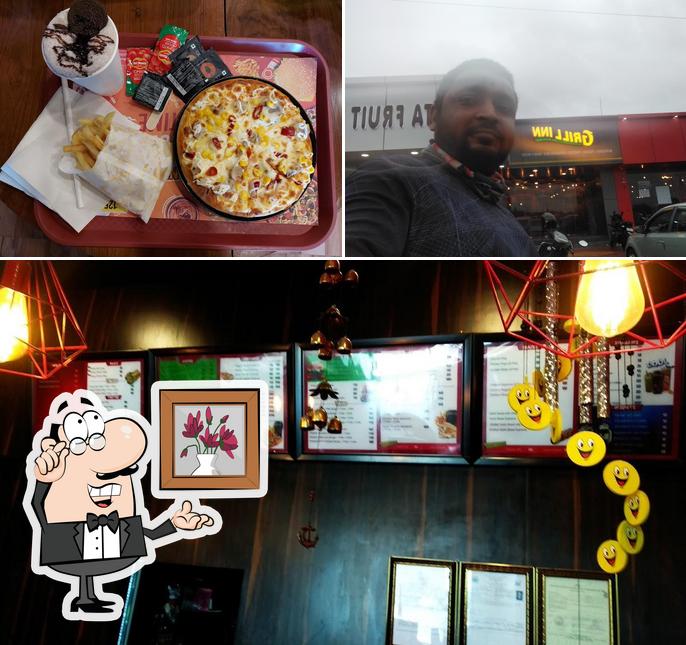 The restaurant's interior and pizza
