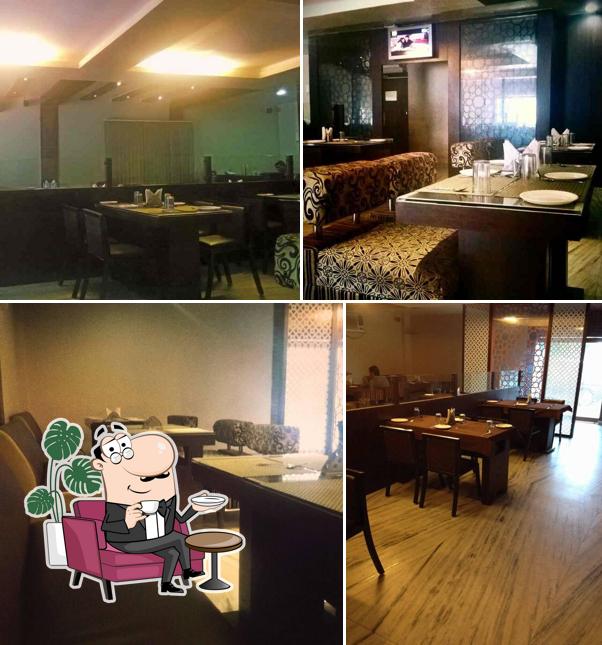 Take a seat at one of the tables at Mahi Restaurant