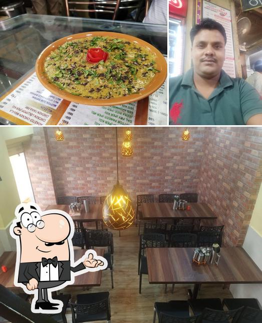 This is the picture depicting interior and pizza at KGN Catterers