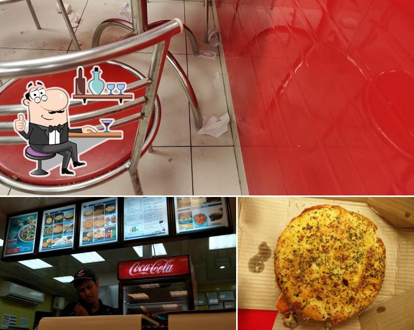 Take a seat at one of the tables at Domino's Pizza Bellandur Village, Bengaluru