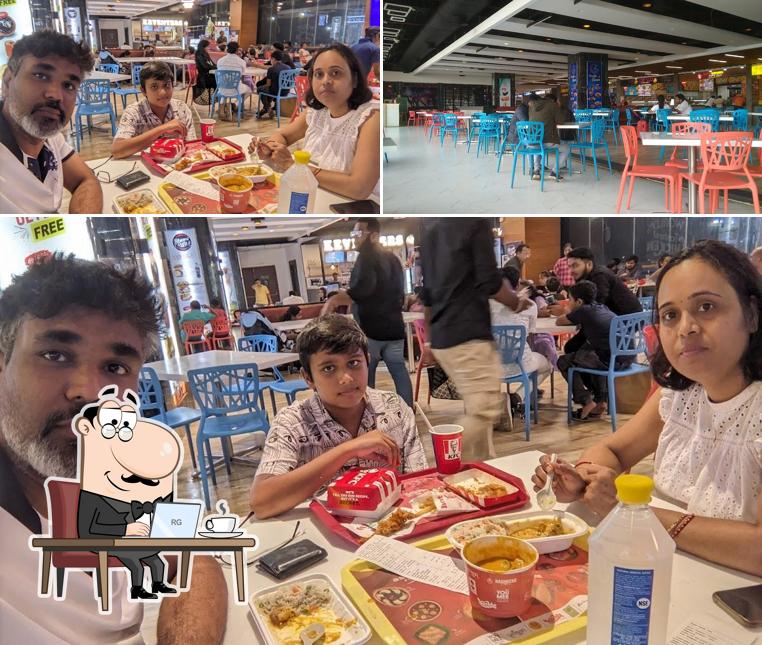 Take a seat at one of the tables at KFC