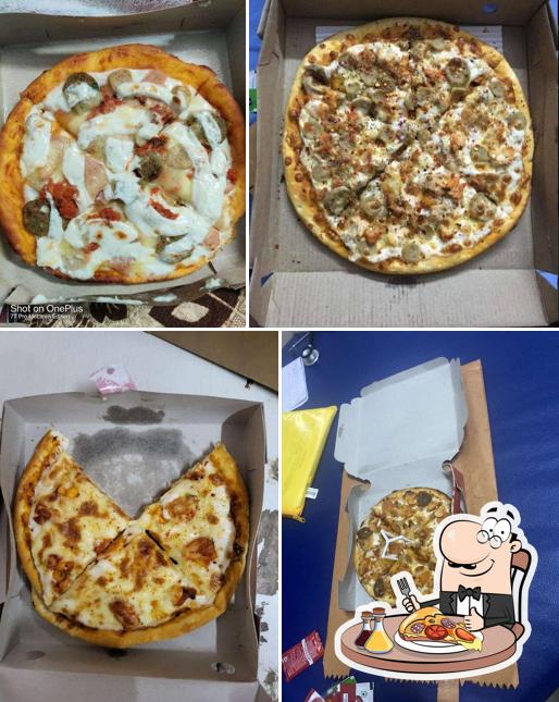 Get pizza at Cosmic Pizza’s