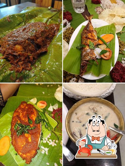 Get various seafood dishes available at Theeram