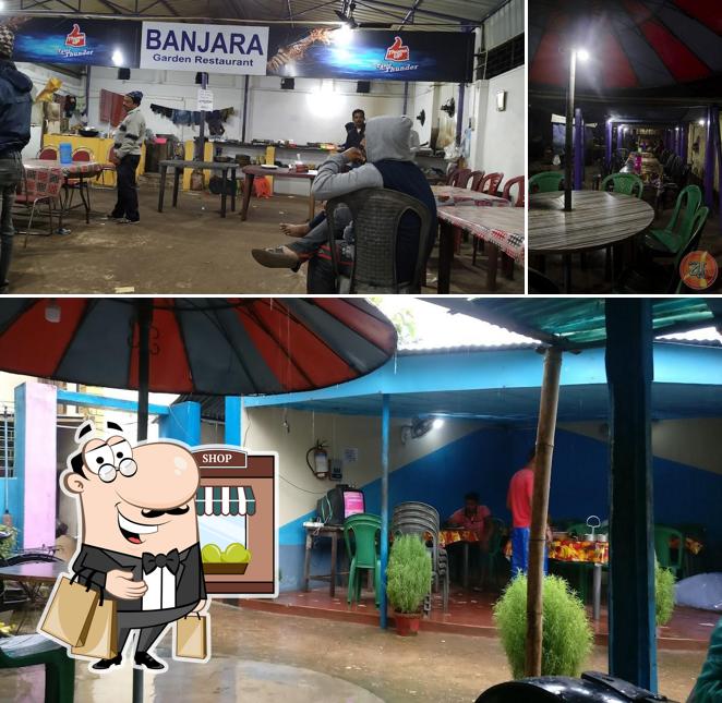 This is the photo showing exterior and dining table at Banjara Garden Restaurant