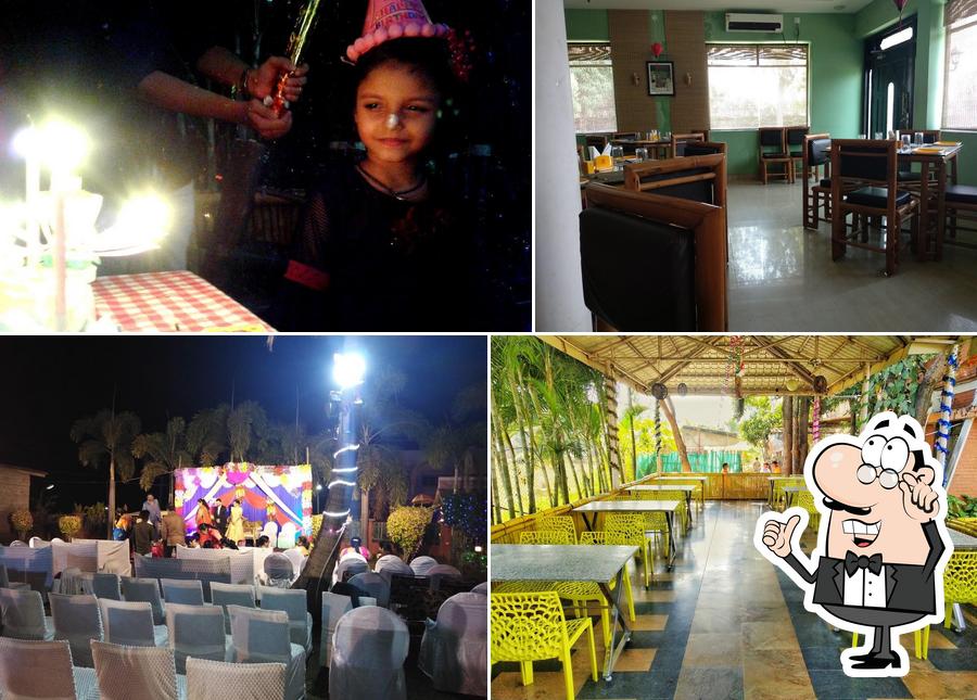 Take a seat at one of the tables at Vatika Garden Restaurant